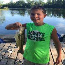 boy holding a fish