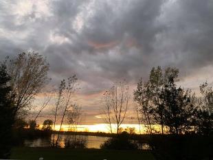 a sunset across one of the lakes